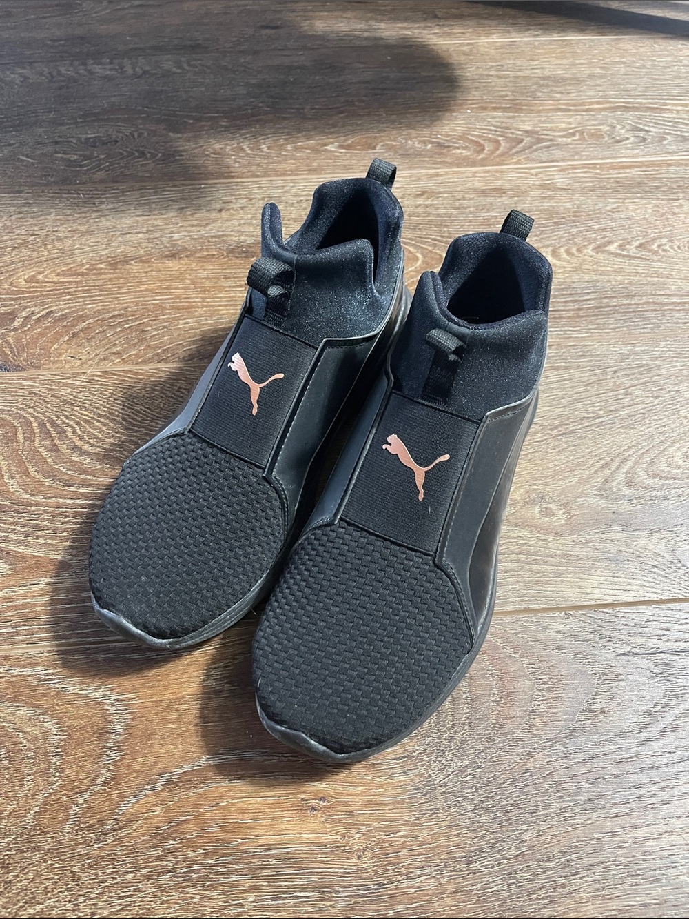Puma Women’s Black Slip-On Athletic Sneakers with Gold Logo